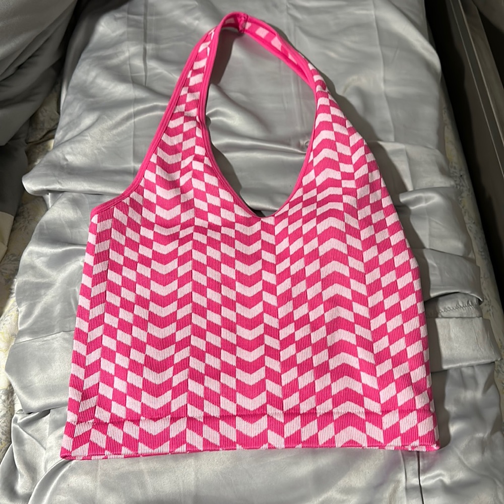 never worn brand new. Not my style. CUTE WORKOUT TOP